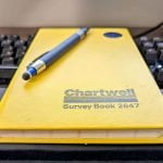Chartwell Yellow Survey Field Book 2647 with blue pen on top