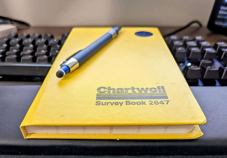 Chartwell Yellow Survey Field Book 2647 with blue pen on top